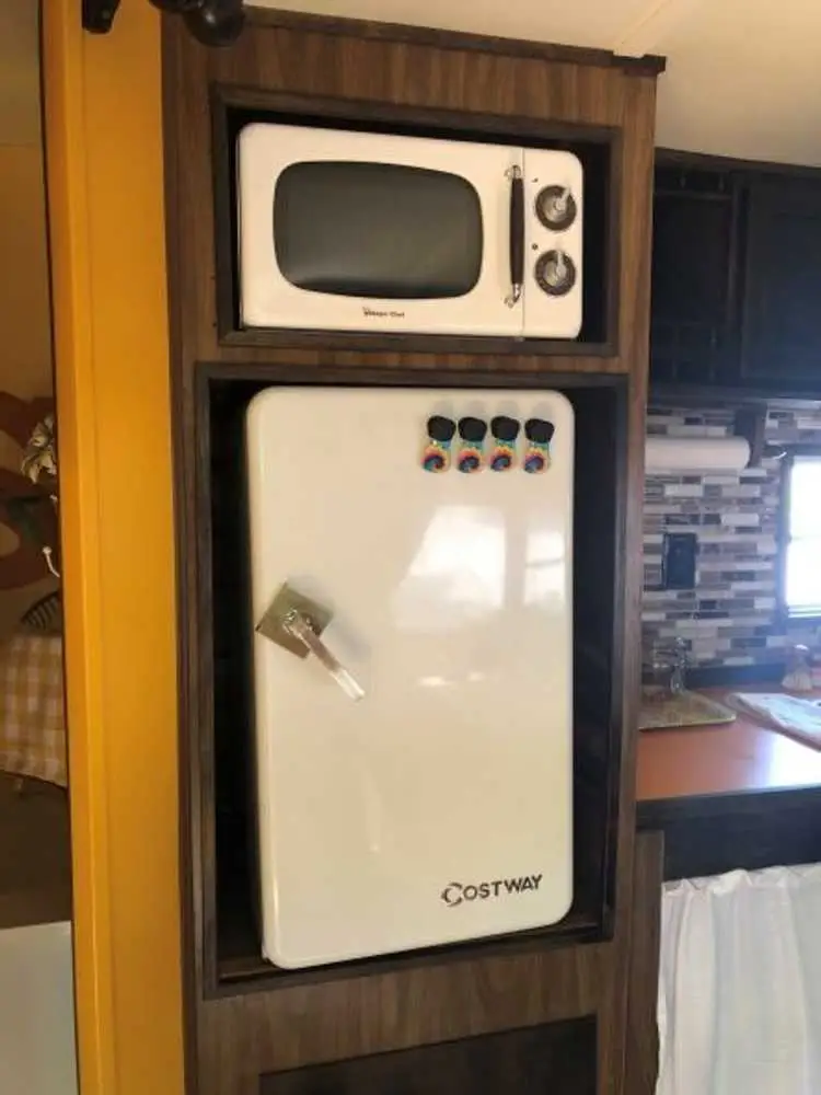 Retro microwave and mini fridge in Begonia – Begonia Vintage Camper at The Outpost NRG