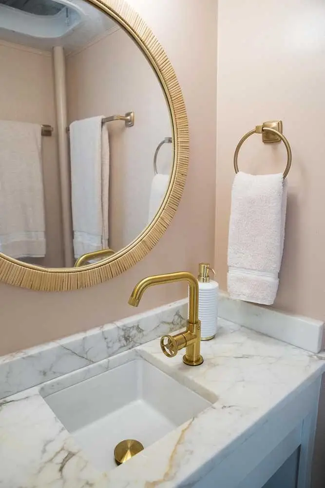Mellow Yellow bathroom vanity with sink and mirror – Mellow Yellow Vintage Camper at The Outpost NRG