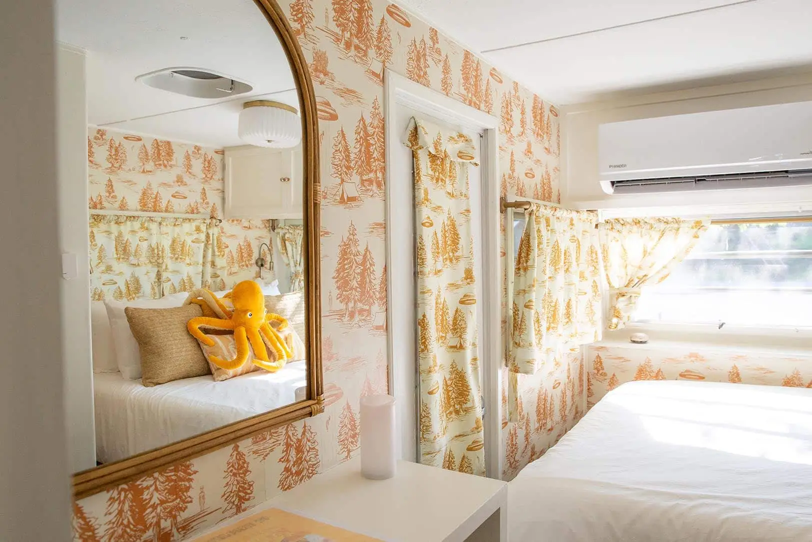 Mellow Yellow bedroom with alien abduction wallpaper – Mellow Yellow Vintage Camper at The Outpost NRG