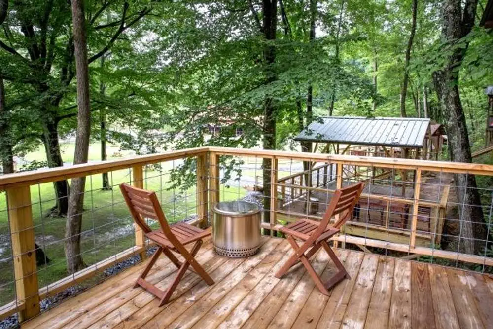 Chairs and fire pit on a tent platform deck – Tent Platforms at The Outpost NRG