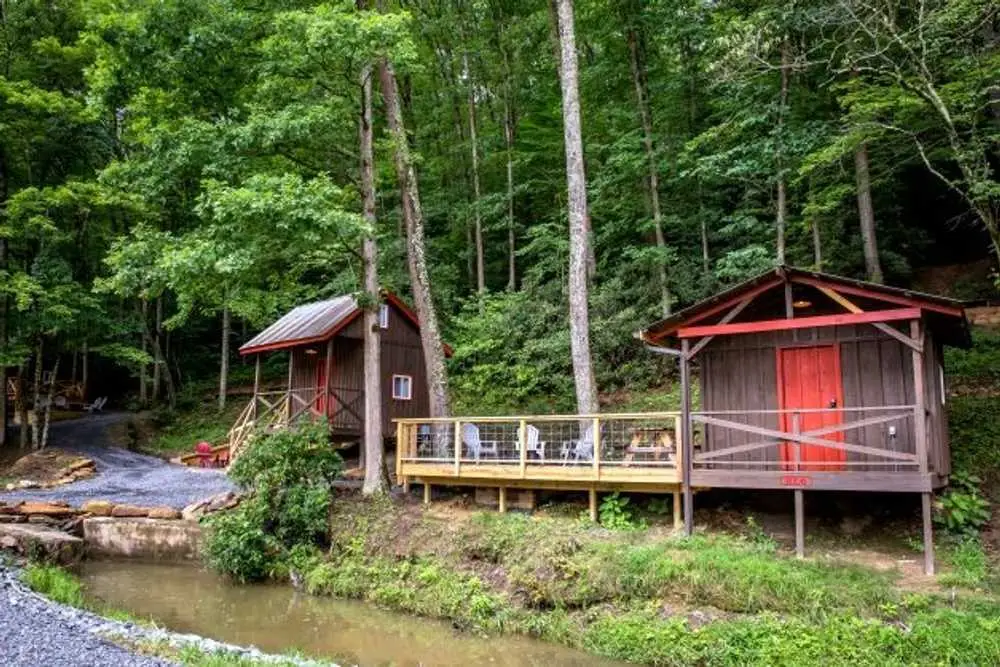 Two creekside bunk cabins with deck and picnic table – Rustic Bunk Cabin at The Outpost NRG