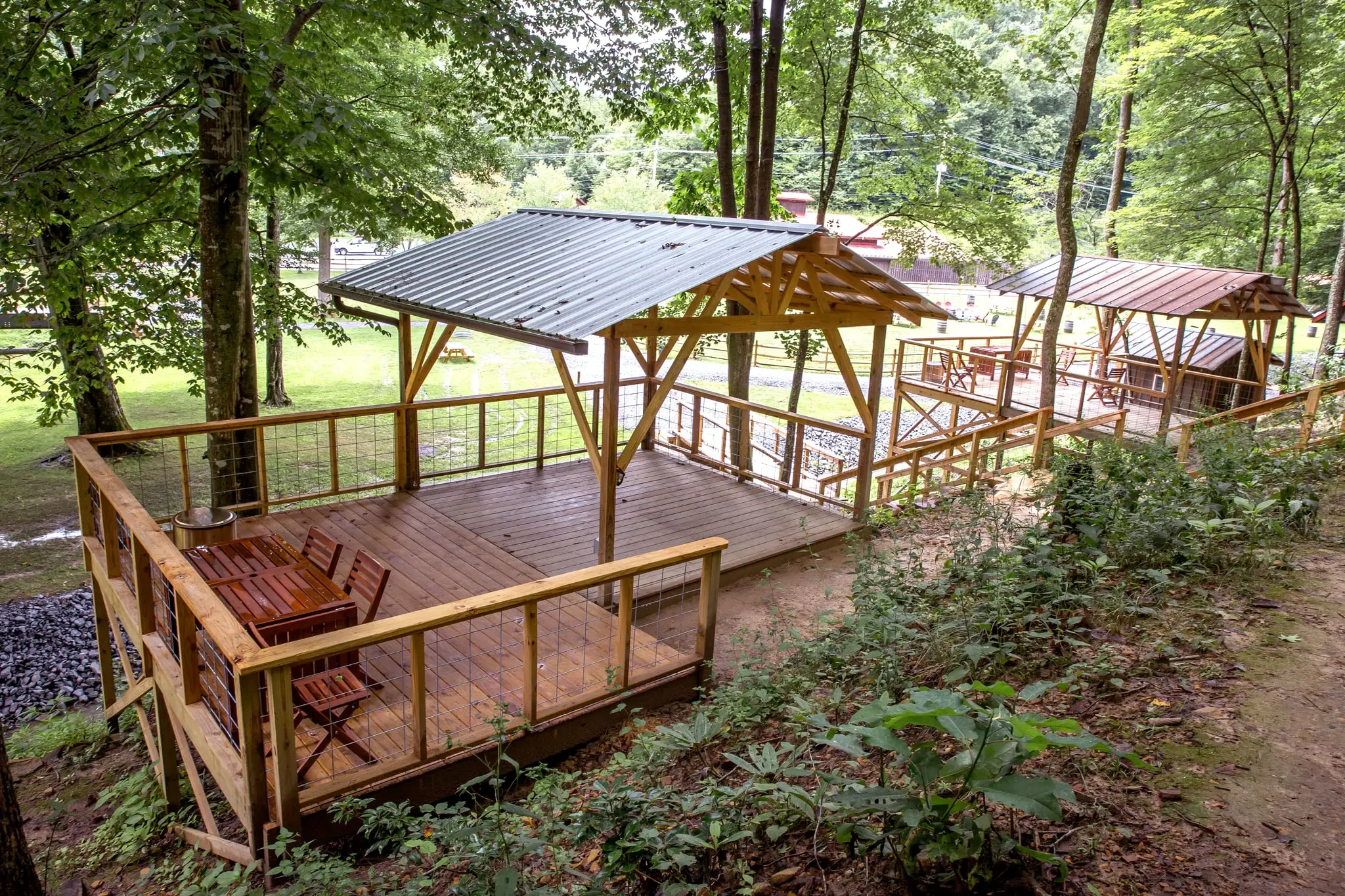 Tent platform deck with covered pavilion and dining area – Tent Platforms at The Outpost NRG