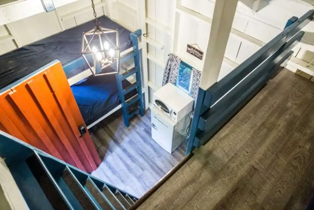 View from the loft overlooking the main room – Rustic Big Family Cabin at The Outpost NRG