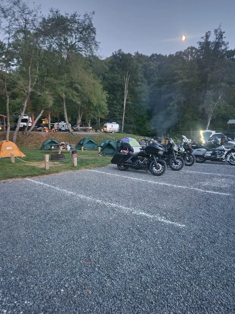 Motorcycles parked beside tents at the Upper Outpost tent sites – Tent Sites at The Outpost NRG