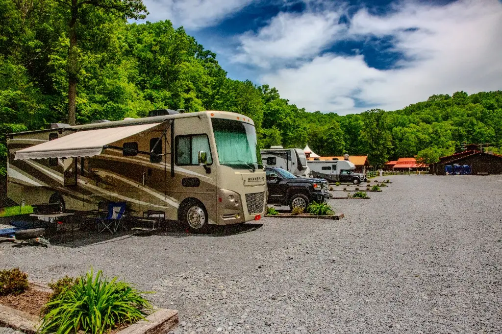 Class A motorhome with awning at a full hookup RV site – Full Hookup RV Site at The Outpost NRG