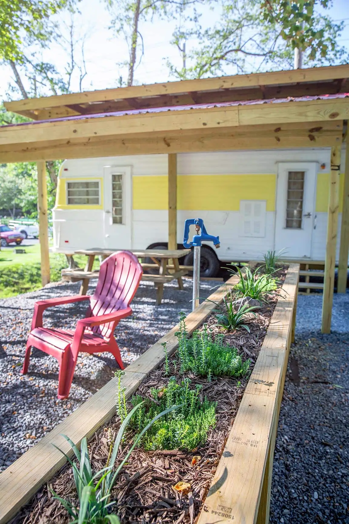Mellow Yellow covered picnic table and fire pit – Mellow Yellow Vintage Camper at The Outpost NRG