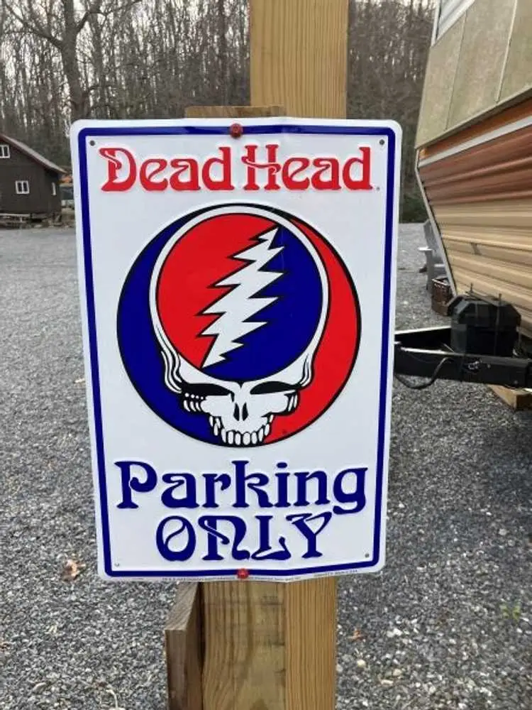 Dead Head parking sign beside the Begonia camper – Begonia Vintage Camper at The Outpost NRG