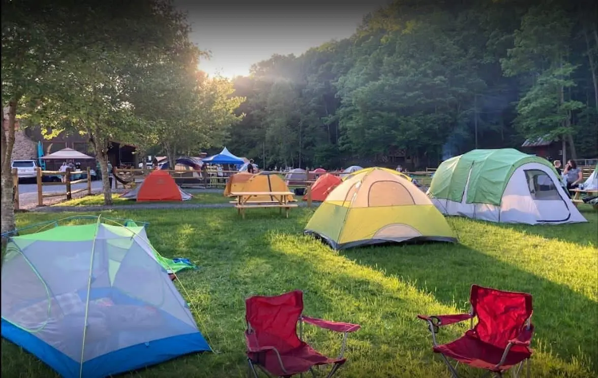 Upper Outpost tent sites beside the music field – Tent Sites at The Outpost NRG