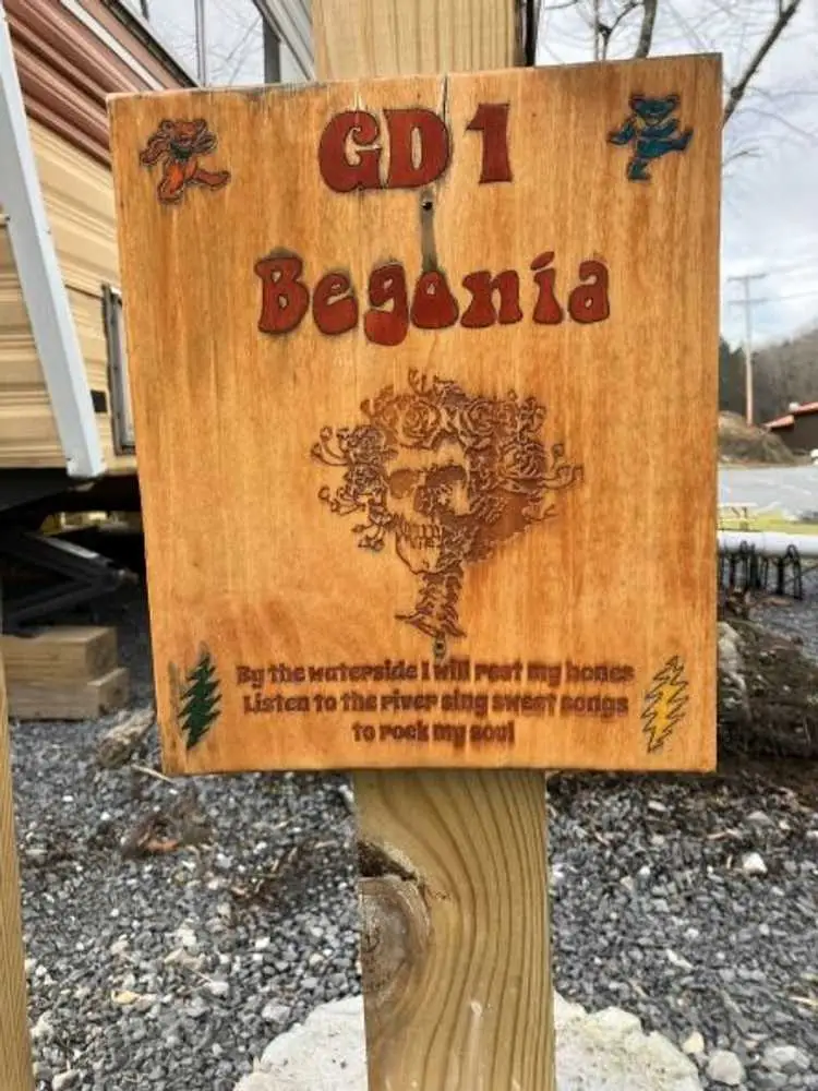 Begonia GD1 site sign with Grateful Dead rose skull artwork – Begonia Vintage Camper at The Outpost NRG
