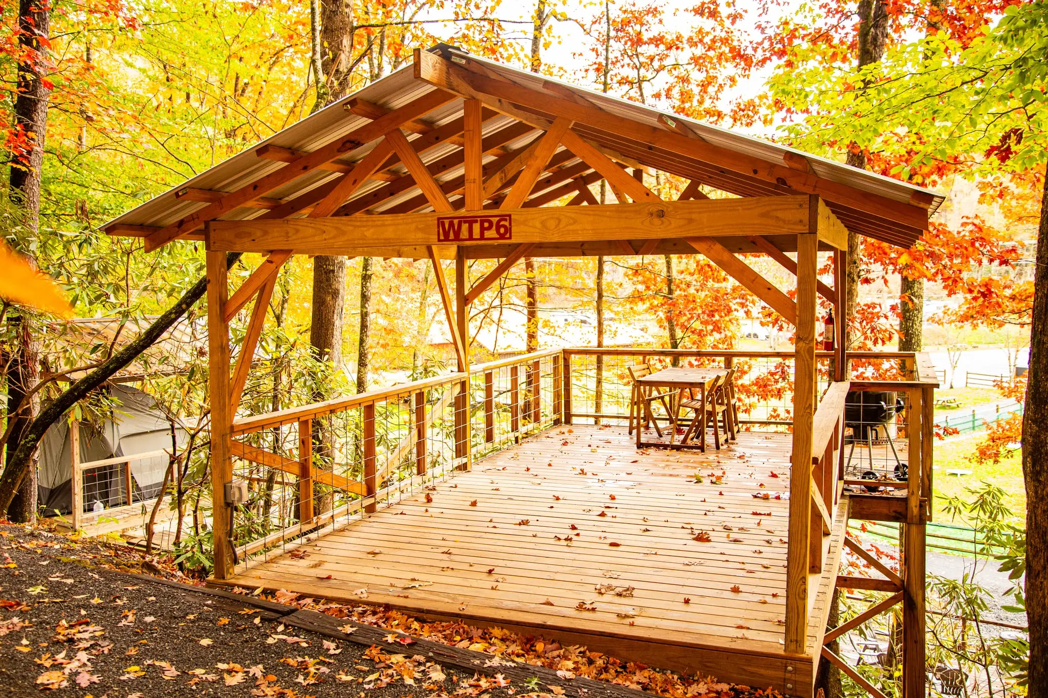 Table and chairs on a tent platform deck – Tent Platforms at The Outpost NRG