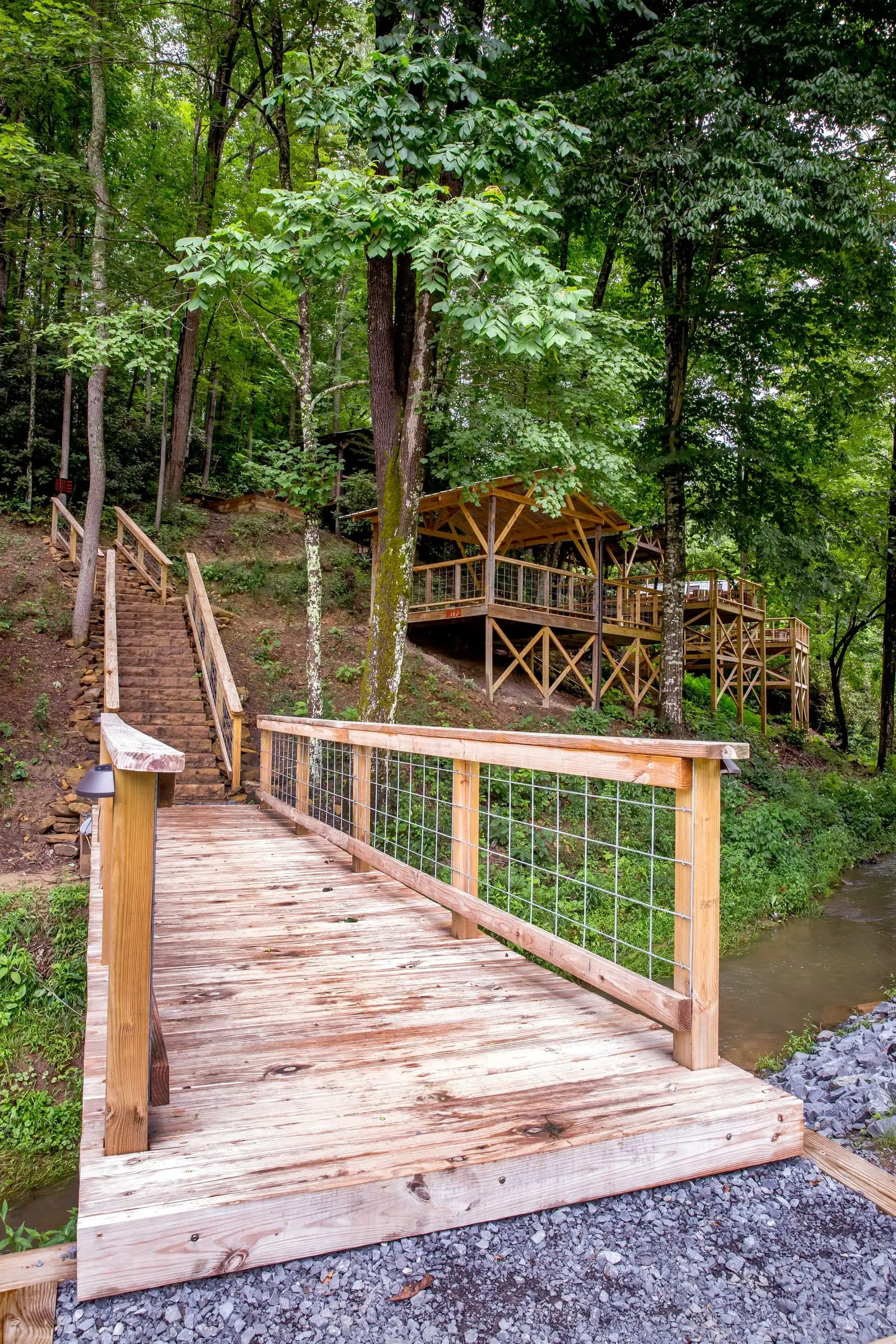 Wooden walkway and stairs to tent platforms – Tent Platforms at The Outpost NRG