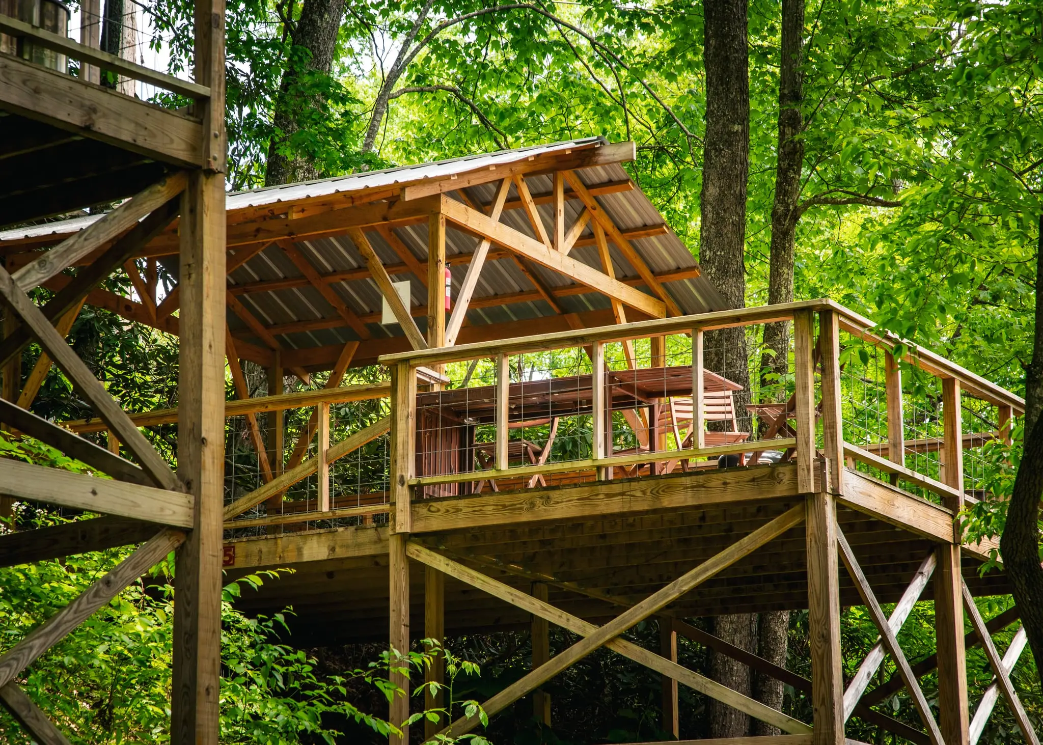 Tent platform nestled in the woods – Tent Platforms at The Outpost NRG
