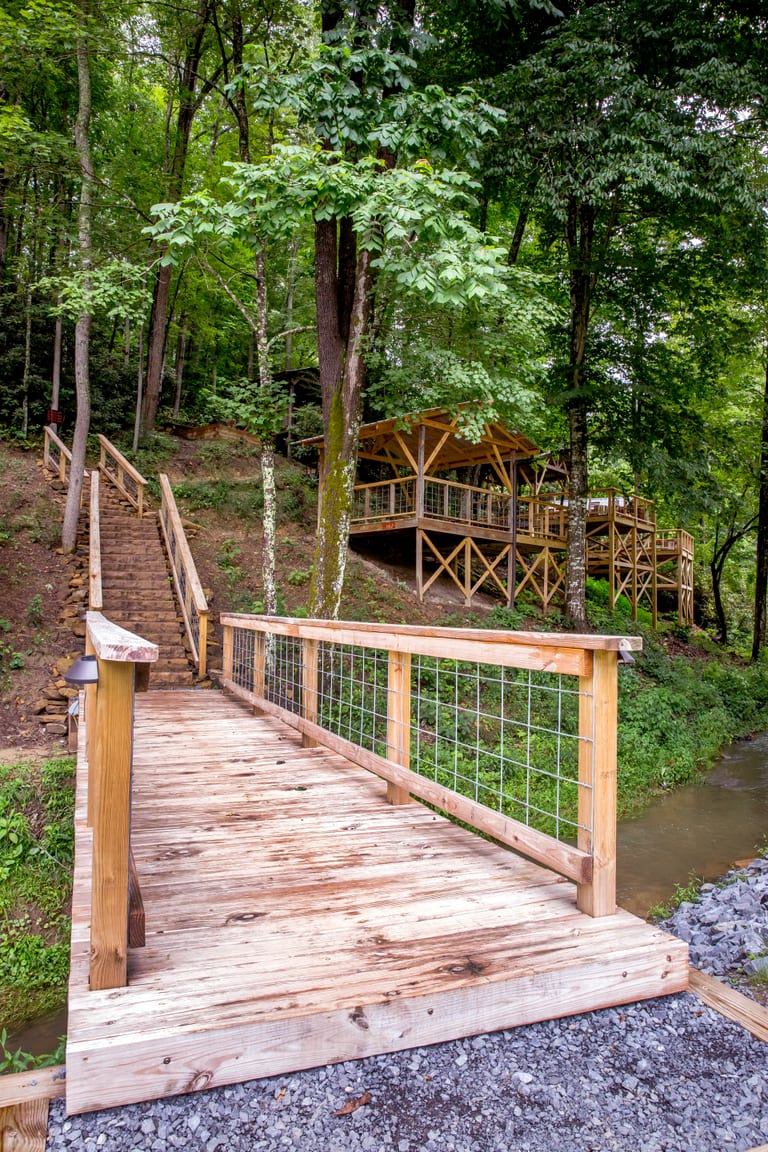 Wooden walkway and stairs to tent platforms – Tent Platforms at The Outpost NRG