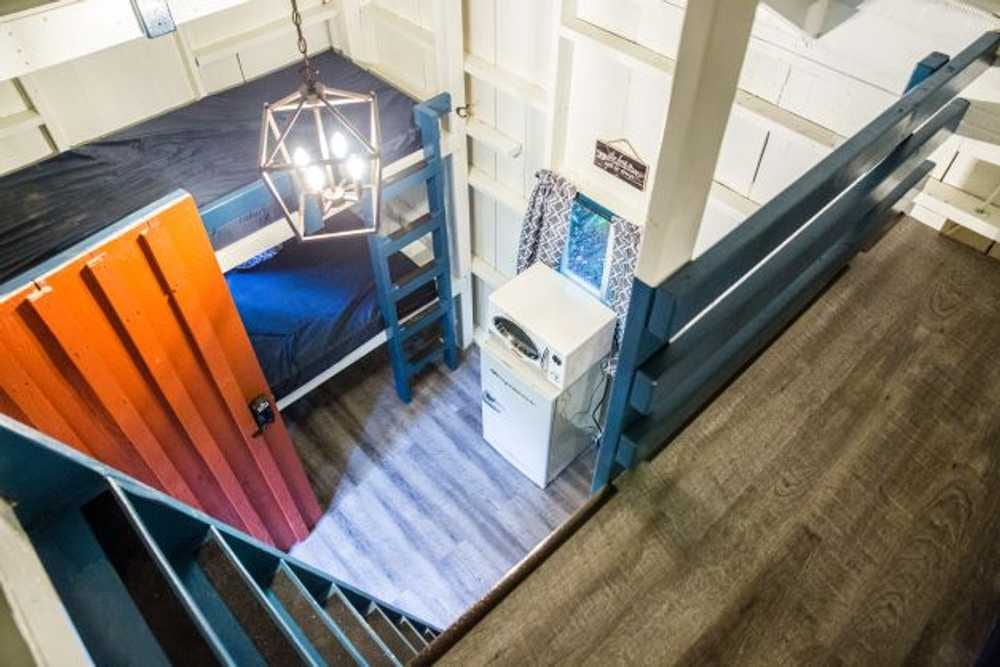 View from the loft overlooking the main room – Rustic Big Family Cabin at The Outpost NRG