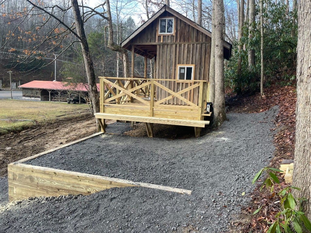 Rustic Family Cabin with deck and gravel patio – Rustic Family Cabin at The Outpost NRG