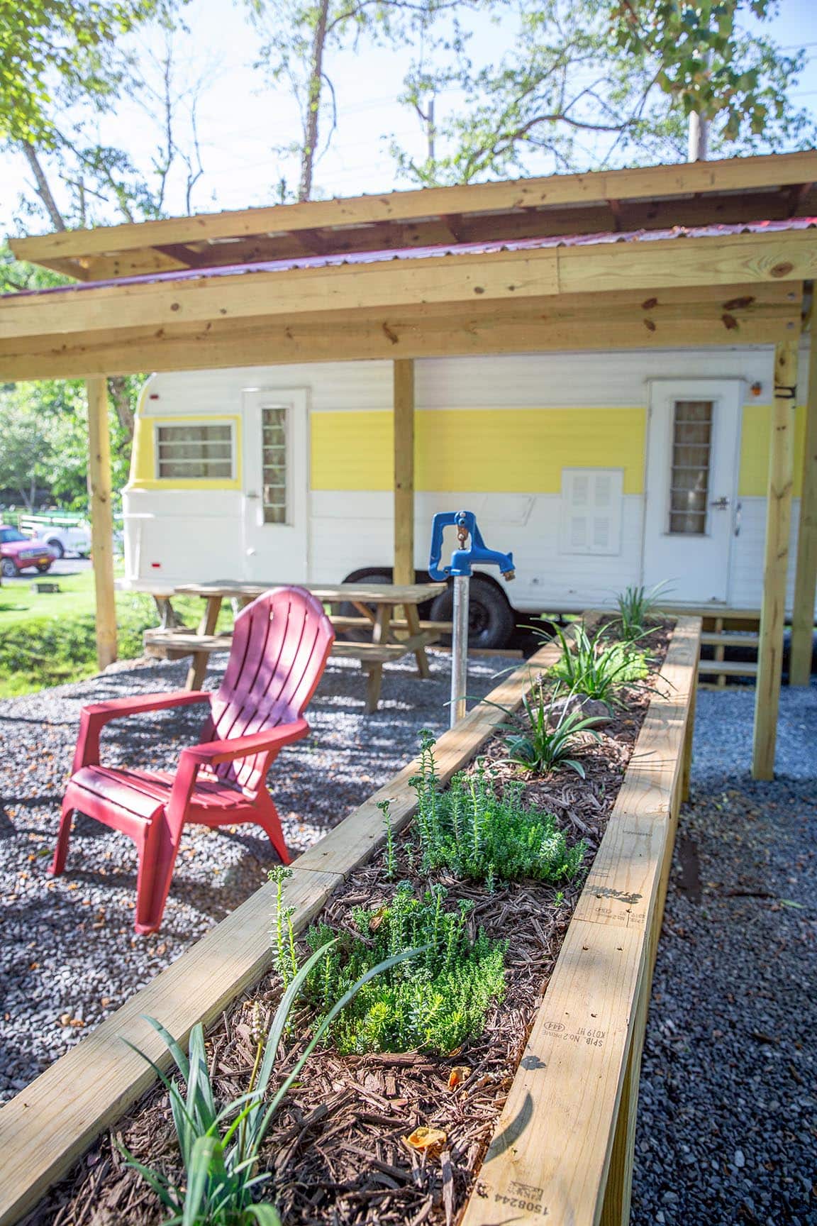 Mellow Yellow covered picnic table and fire pit – Mellow Yellow Vintage Camper at The Outpost NRG